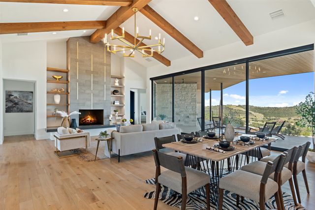a view of a livingroom with furniture and a fireplace