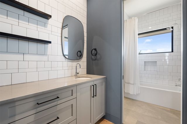 an empty room with floor to ceiling window