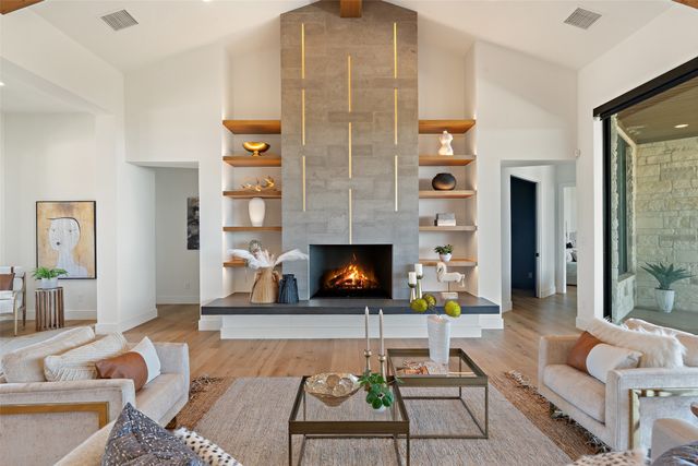 a living room with furniture and a fireplace