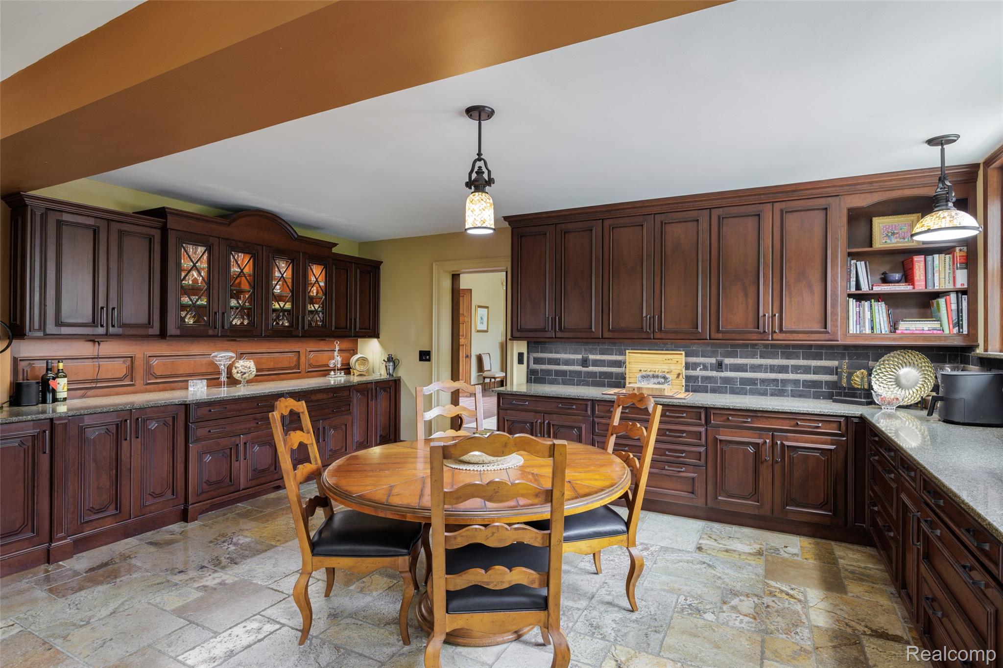 189 Cloverly Road Grosse Pointe, MI 48236 - Photo 25 of 93 The everyday gathering place. Rich custom cabinetry, generous work surfaces, and a welcoming breakfast area make the kitchen as inviting as it is functional. Thoughtfully designed for modern living while complementing the home’s architectural character, it is a space where everyday routines and special occasions come together with equal ease.