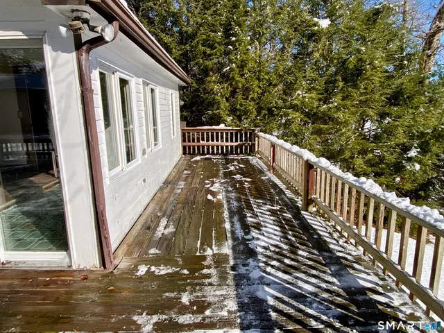 a view of a backyard with wooden floor