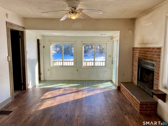a view of an empty room with a window