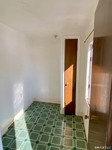 a view of entry way with wooden floor