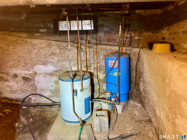 a view of a field with trees in the background