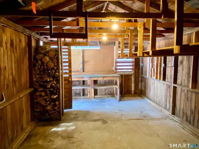 a view of wooden door in backyard of house