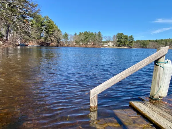 a view of wooden floor with a lake view