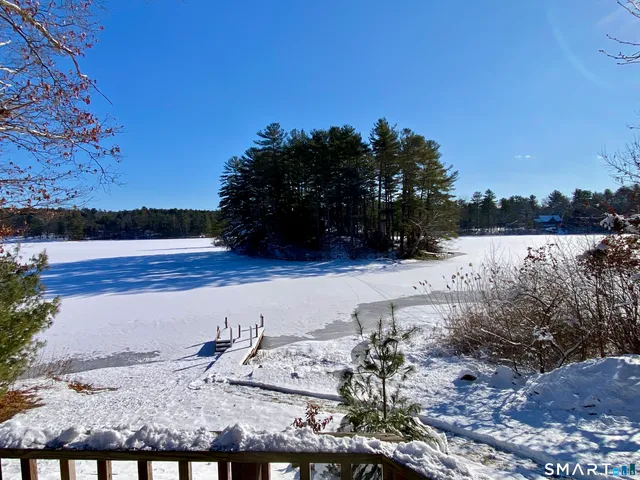 a view of a balcony with wooden floor
