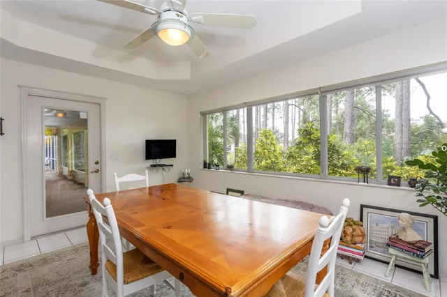 a dining room with a table and chairs