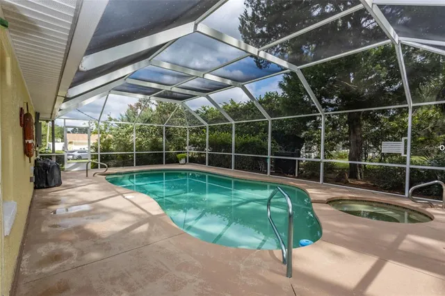 a view of a backyard with table and chairs and wooden fence