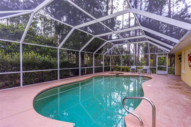 a view of a swimming pool with a patio