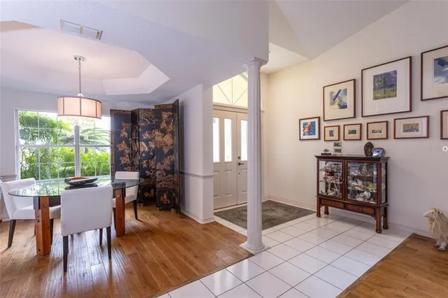 a view of a livingroom with furniture window and wooden floor