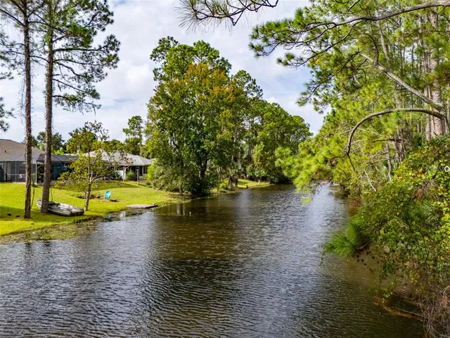a view of a lake with a yard
