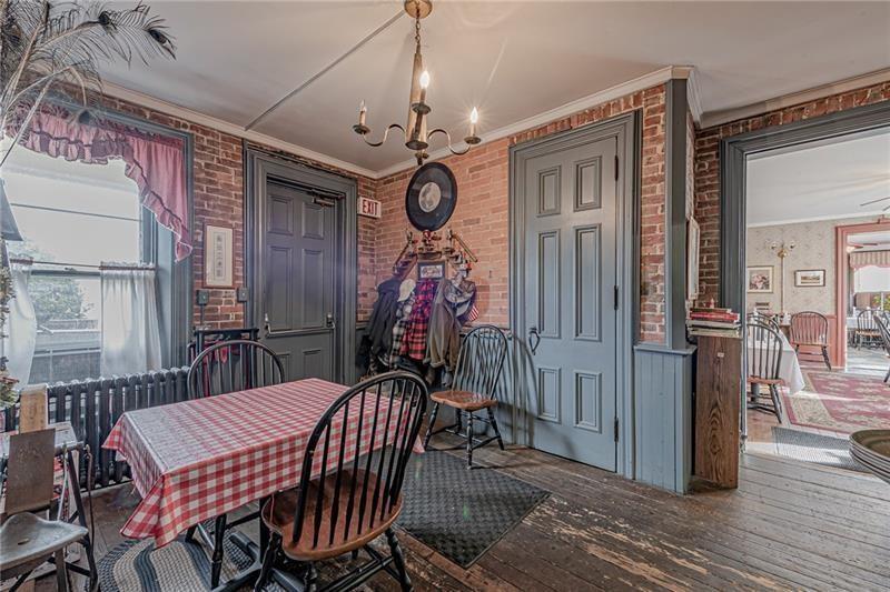 1892 McClellandtown Road Adah, PA 15410 - Photo 11 of 33 a view of a dining room with furniture window and wooden floor