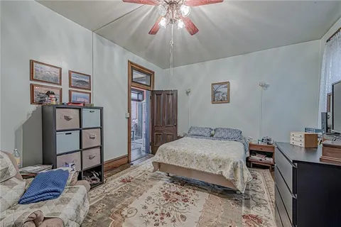 a bed room with bed and window