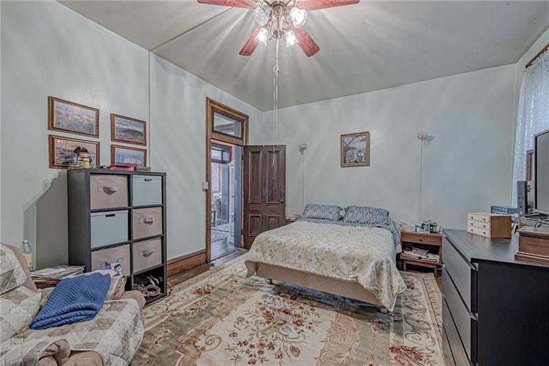 1892 McClellandtown Road Adah, PA 15410 - Photo 13 of 33 a bedroom with a bed and a flat tv screen on dresser