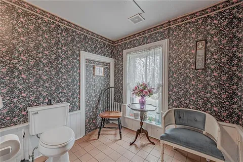 a bathroom with a bathtub a sink and a window