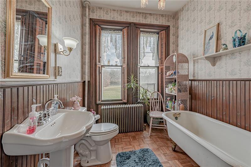 1892 McClellandtown Road Adah, PA 15410 - Photo 16 of 33 a bathroom with a bathtub a sink and a window
