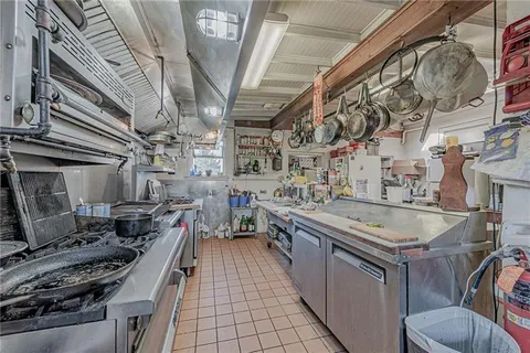 a utility room with lots of wooden furniture