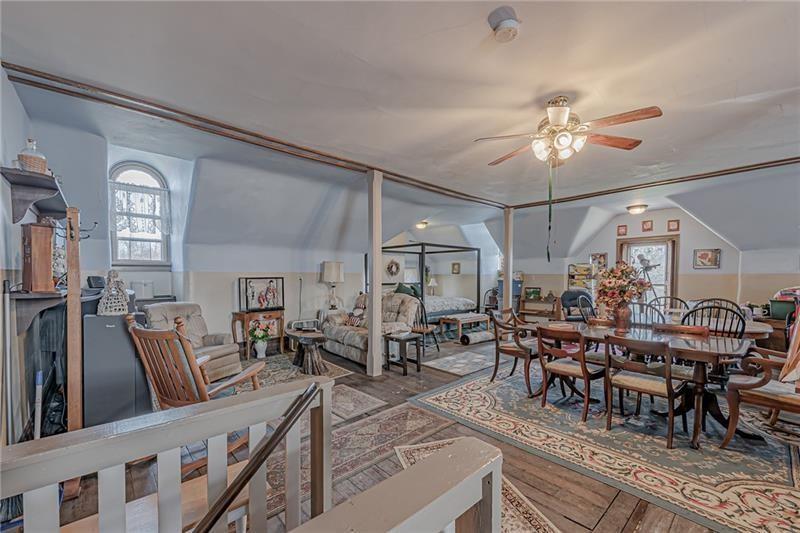 1892 McClellandtown Road Adah, PA 15410 - Photo 22 of 33 a view of a dining room and livingroom view with furniture a rug and a chandelier