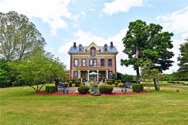 a front view of a house with garden