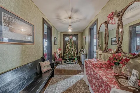 a view of entryway dining room and hall with wooden floor
