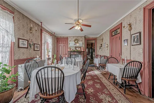 a view of a hall with dining area