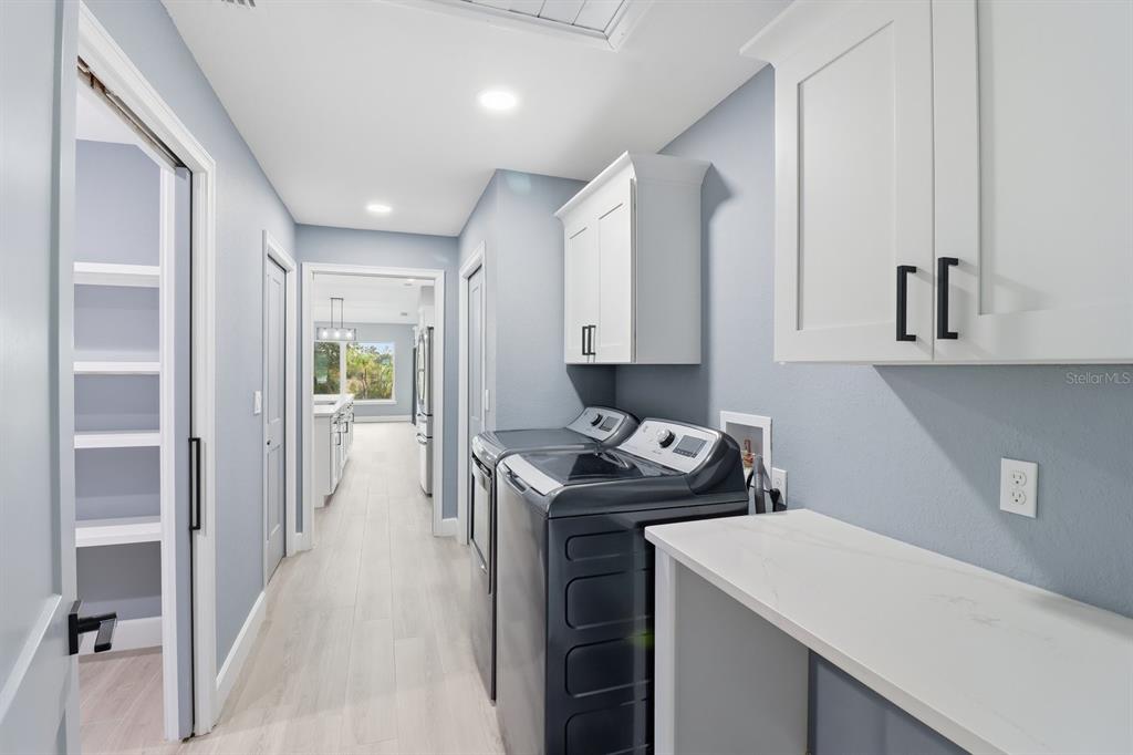 18459 Southwest 66th Loop Dunnellon, FL 34432 - Photo 20 of 41 a kitchen with a sink stove and cabinets
