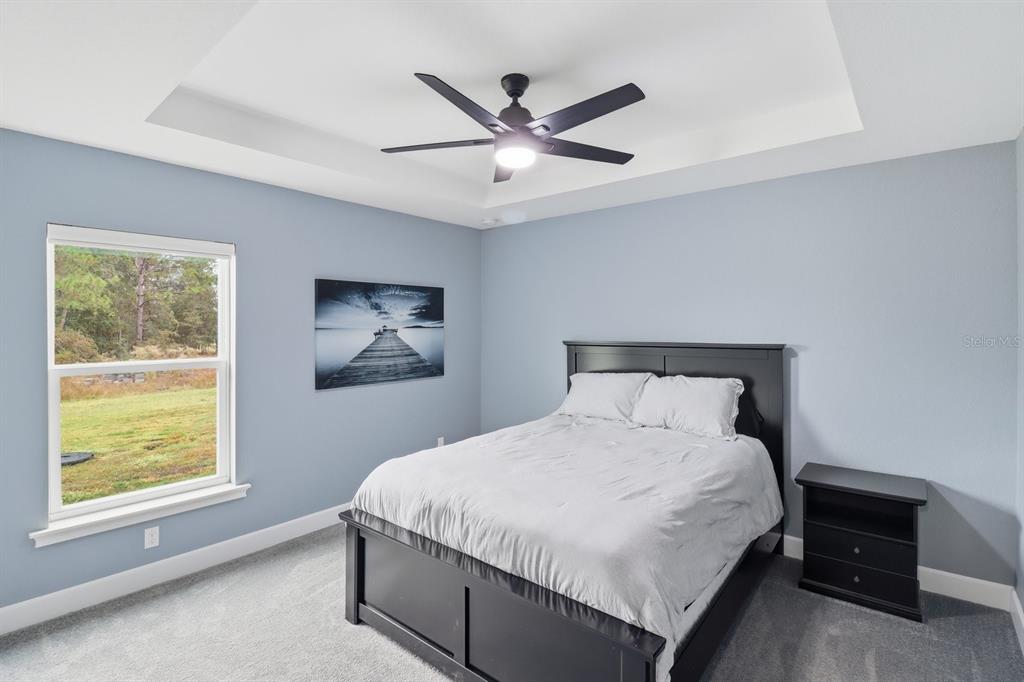 18459 Southwest 66th Loop Dunnellon, FL 34432 - Photo 22 of 41 a bedroom with a bed and window