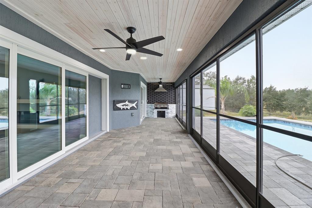 18459 Southwest 66th Loop Dunnellon, FL 34432 - Photo 29 of 41 a view of empty room with wooden floor and fan