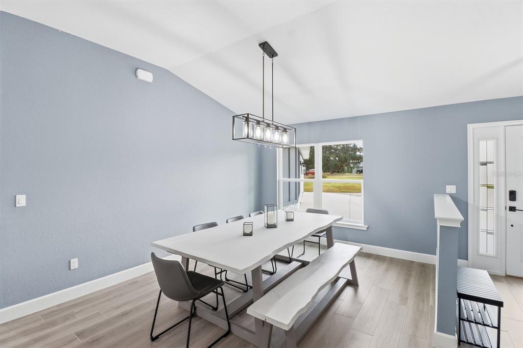 18459 Southwest 66th Loop Dunnellon, FL 34432 - Photo 5 of 41 a view of a dining room with furniture window and wooden floor