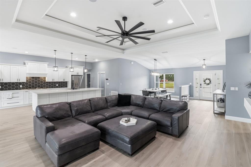 18459 Southwest 66th Loop Dunnellon, FL 34432 - Photo 8 of 41 a living room with furniture kitchen view and a wooden floor