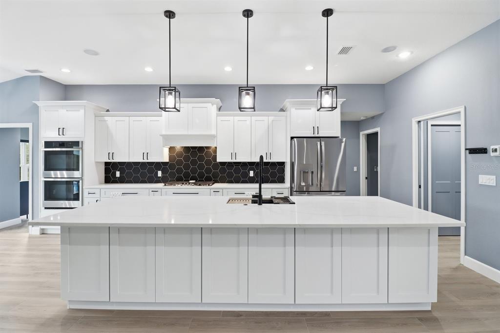 18459 Southwest 66th Loop Dunnellon, FL 34432 - Photo 9 of 41 a large kitchen with cabinets