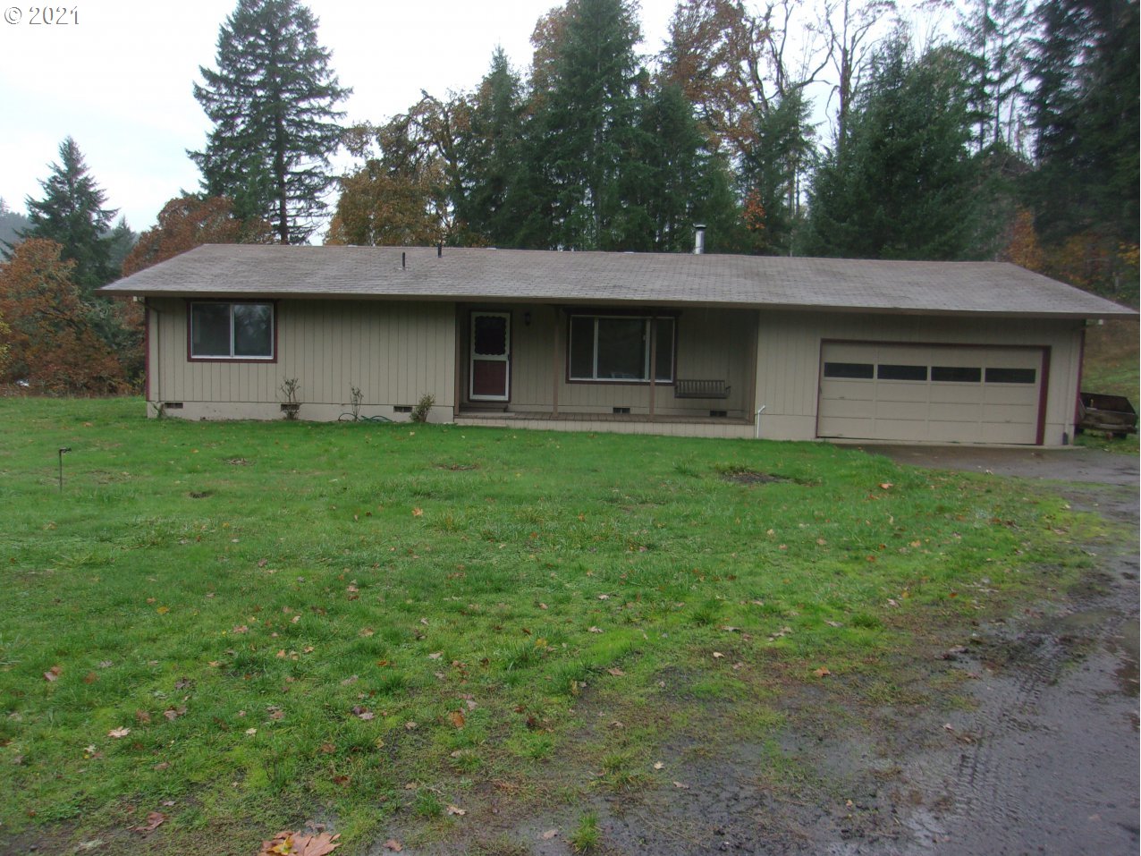 39725 Southwest Fort Hill Road Willamina, OR 97396 - Photo 1 of 16 a front view of a house with a garden