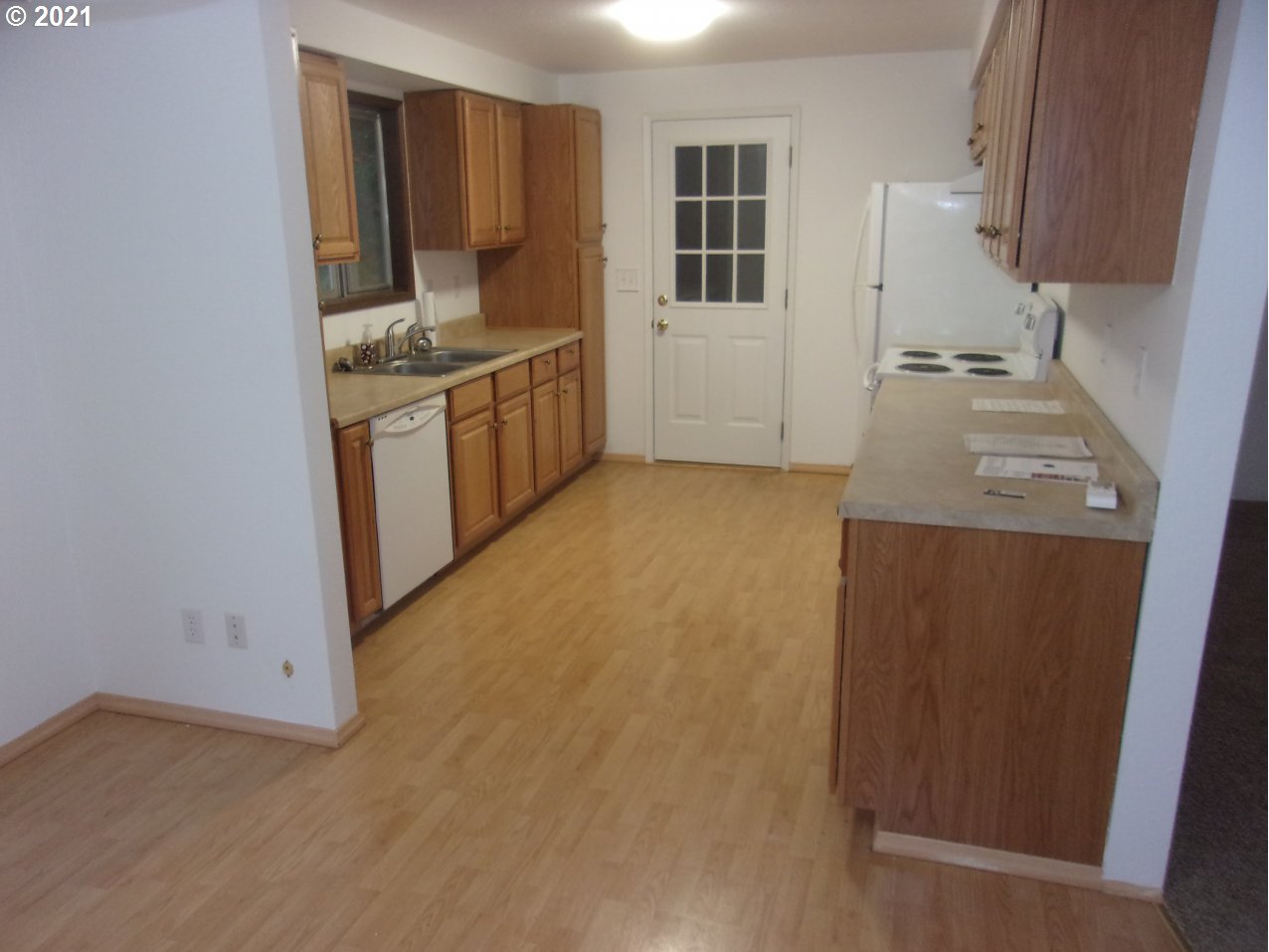 39725 Southwest Fort Hill Road Willamina, OR 97396 - Photo 6 of 16 a kitchen with a sink a stove and cabinets