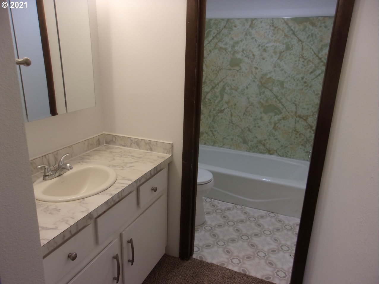 39725 Southwest Fort Hill Road Willamina, OR 97396 - Photo 8 of 16 a bathroom with a granite countertop sink and a mirror