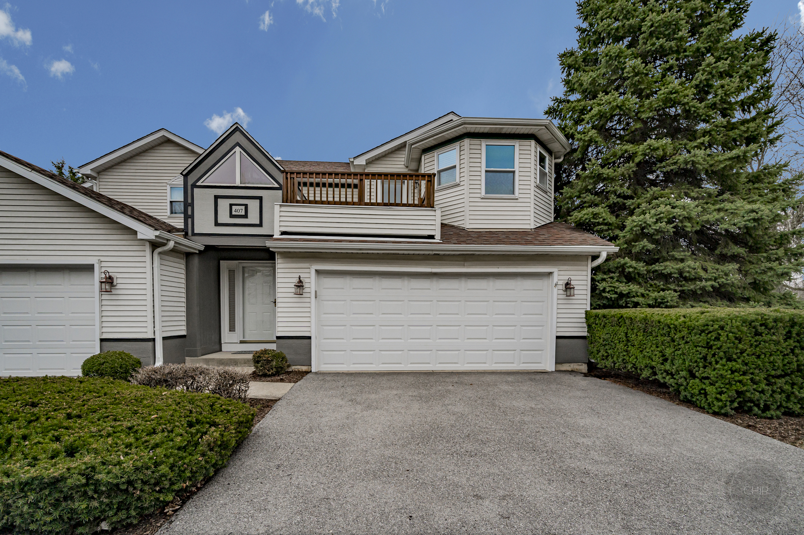 407 Inner Cir Drive Bolingbrook, IL 60490 - Photo 2 of 20 a front view of a house with a yard and garage