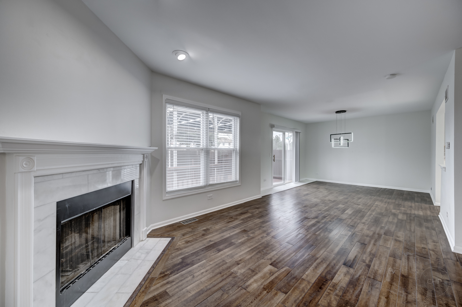407 Inner Cir Drive Bolingbrook, IL 60490 - Photo 3 of 20 a view of empty room with wooden floor and fireplace