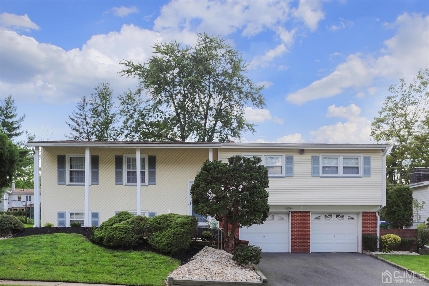 17 Peake Road Edison, NJ 08837 - Photo 2 of 18 a front view of a house with garden