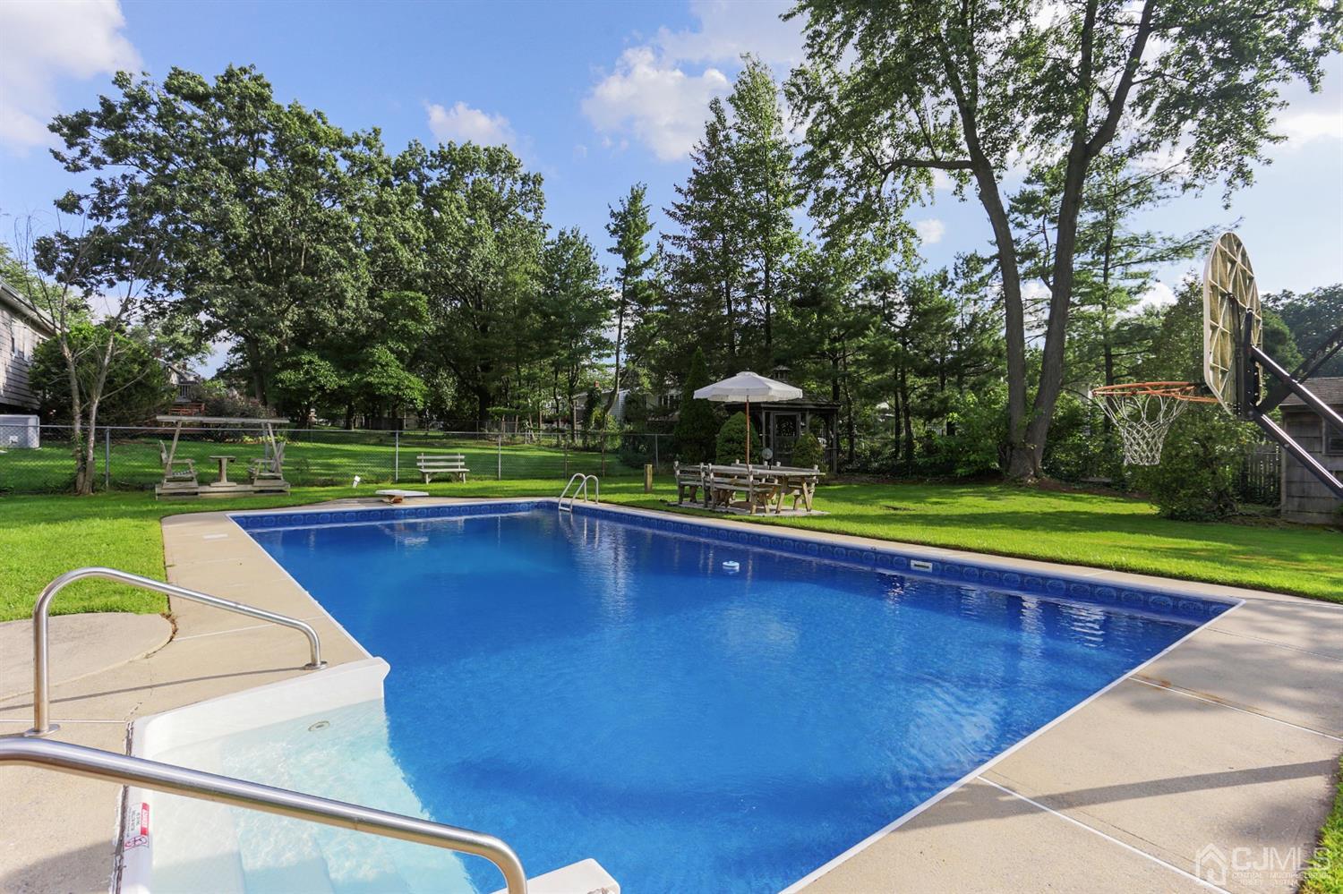 17 Peake Road Edison, NJ 08837 - Photo 17 of 18 a view of swimming pool with a yard