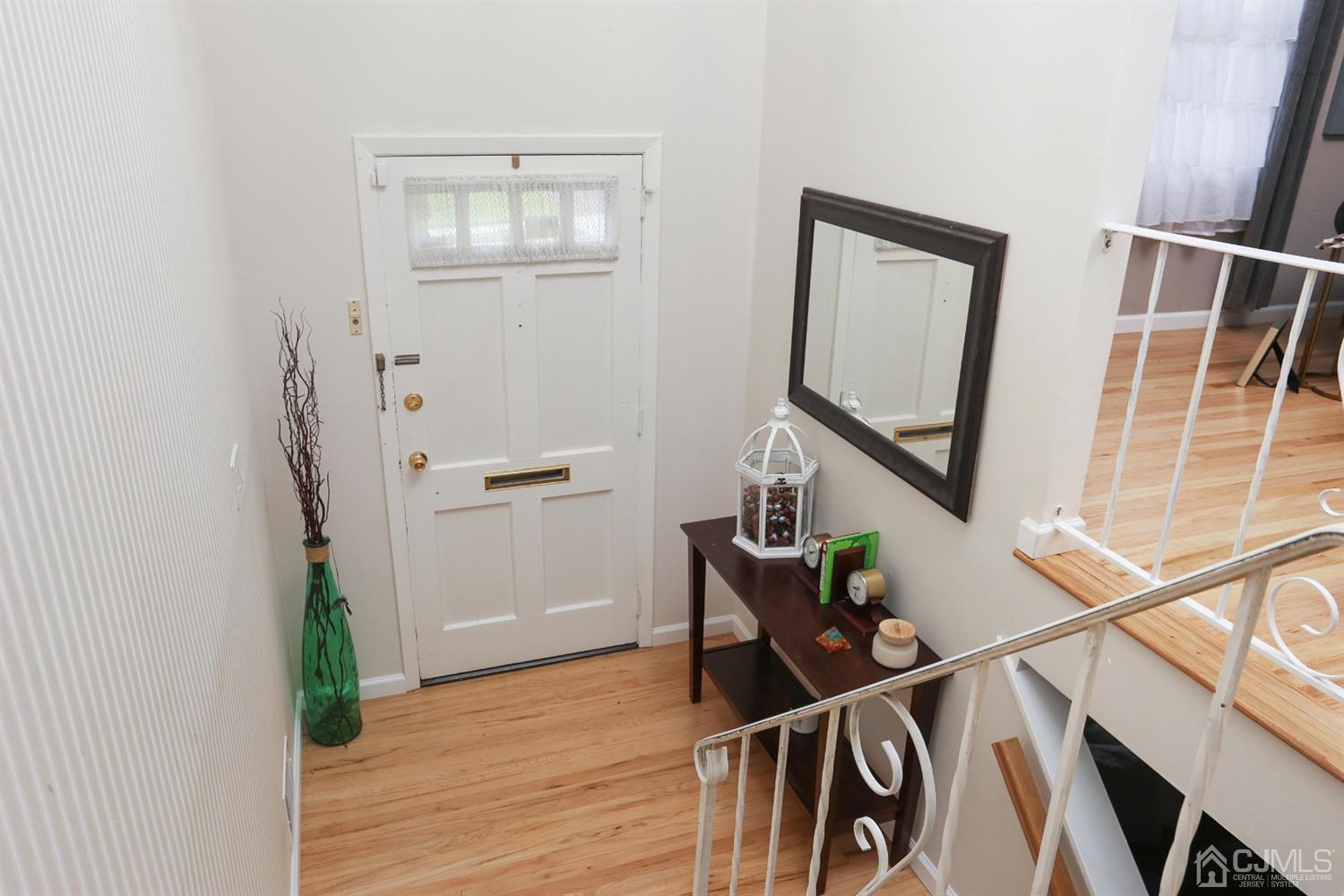 17 Peake Road Edison, NJ 08837 - Photo 3 of 18 a view of entryway and hall with wooden floor