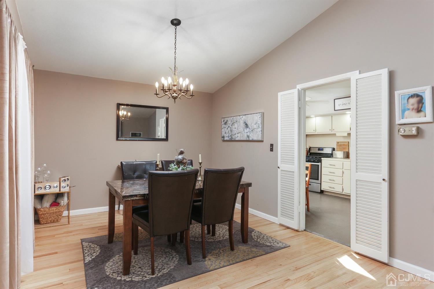 17 Peake Road Edison, NJ 08837 - Photo 6 of 18 a view of a dining room with furniture and wooden floor