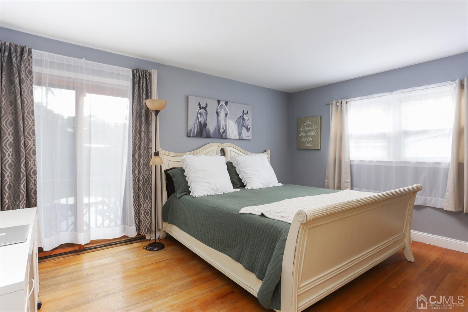 17 Peake Road Edison, NJ 08837 - Photo 10 of 18 a bed sitting in a bedroom next to a window