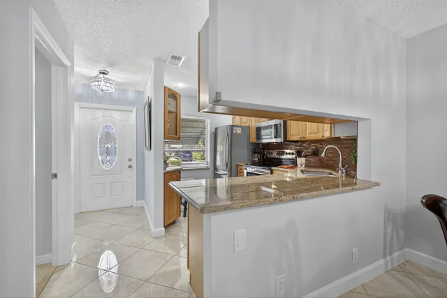 a bedroom with a bed and a lamp