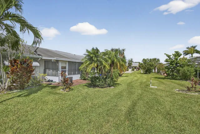 an aerial view of a houses with outdoor space