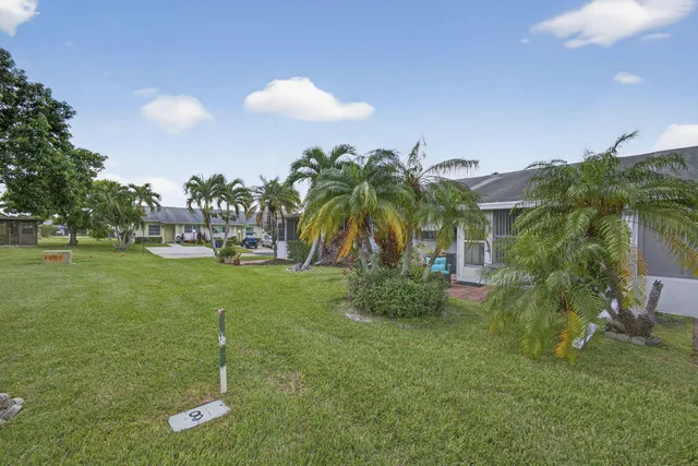 an aerial view of a house with outdoor space