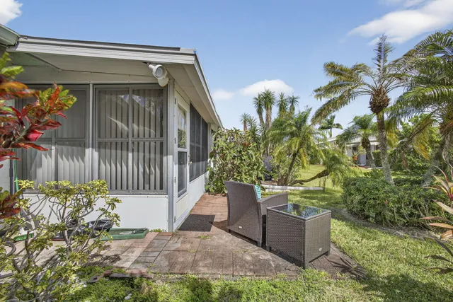 a view of balcony with couch and wooden floor