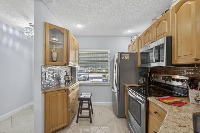 a kitchen with a stove and a microwave