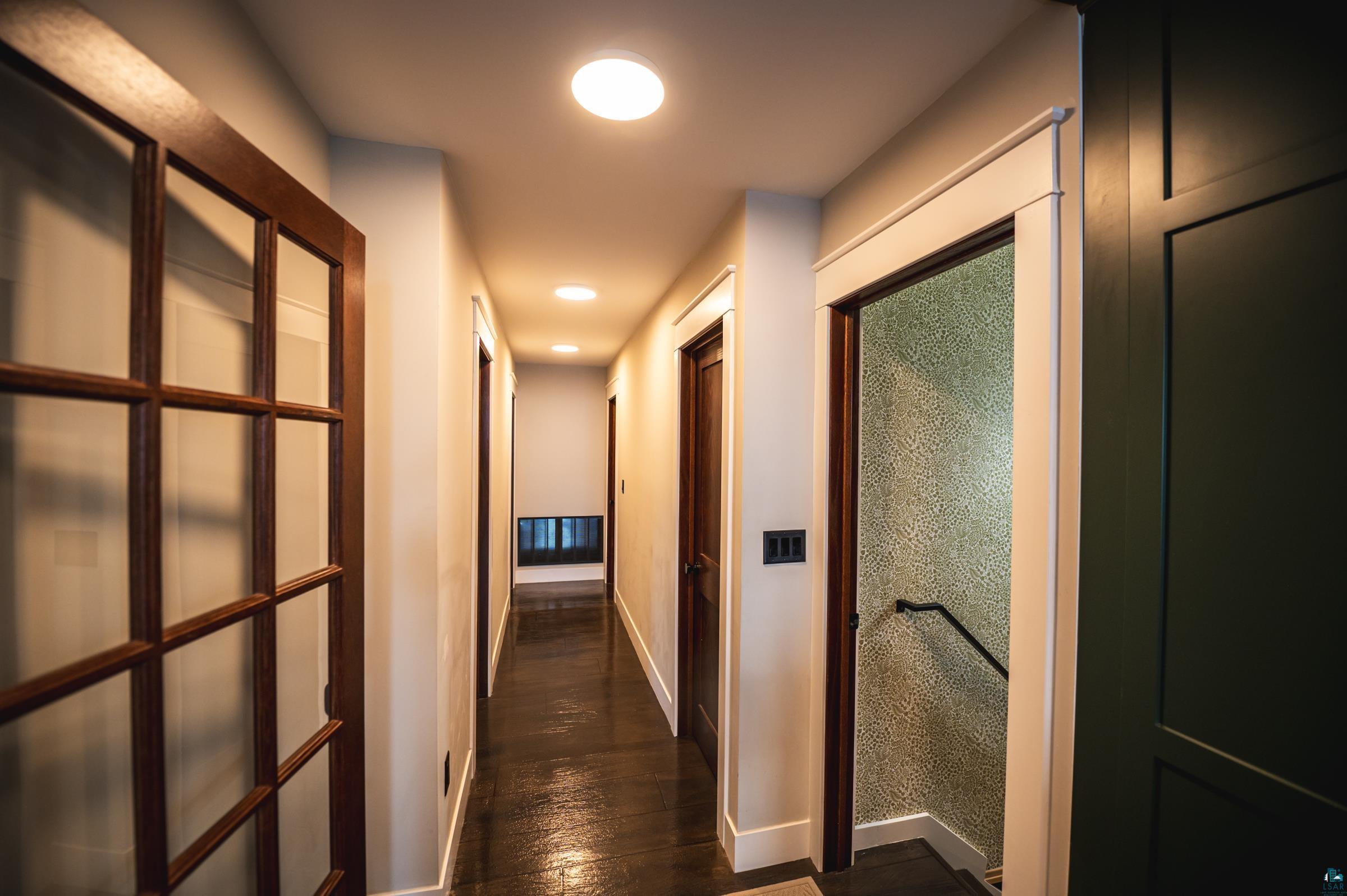 14635 Canadian Border Road Ely, MN 55731 - Photo 78 of 94 Hallway featuring wood-finish flooring, recessed lighting, and a paneled accent wall