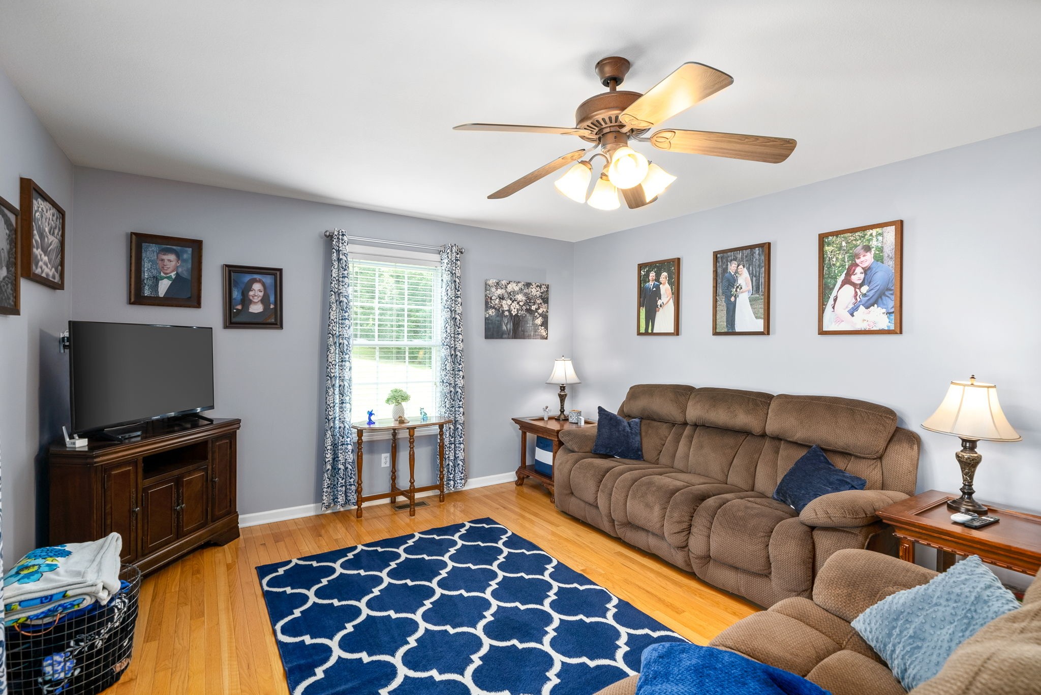 265 Sara Drive Tennessee Ridge, TN 37178 - Photo 8 of 39 a living room with furniture ceiling fan and a window