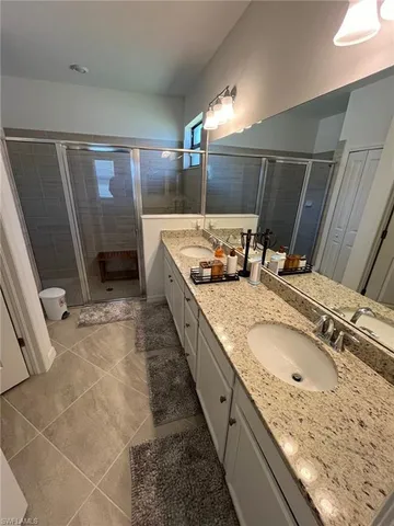 an aerial view of a house with a garden and lake view